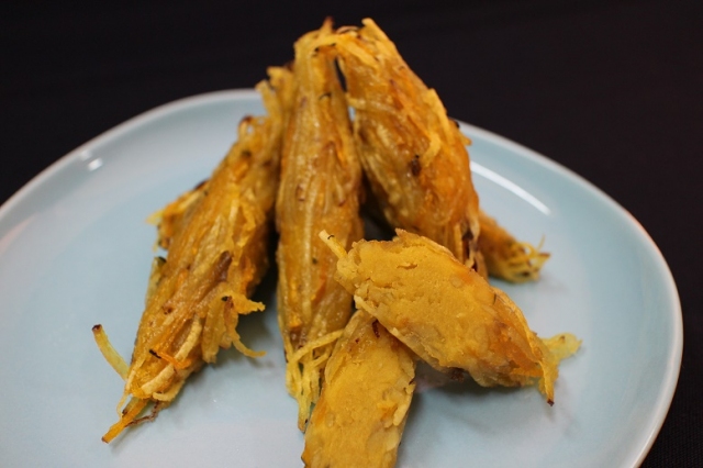 Frozen steemed bagworm shaped sweet potato rolls covered with sliced potato & pampkin